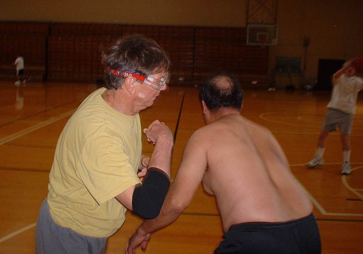 Players colliding under the basket